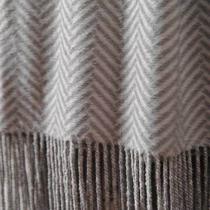 CozyNest Decor Cuddle Dreams silk throw blanket with hand-knotted fringe, herringbone gray, soft, breathable, and luxurious for cozy comfort.