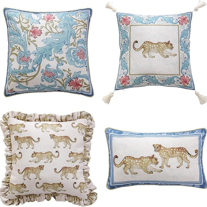 Set of four CozyNest Decor designer throw pillow covers with vintage French linen, cheetah pattern, and luxurious pendant accents.