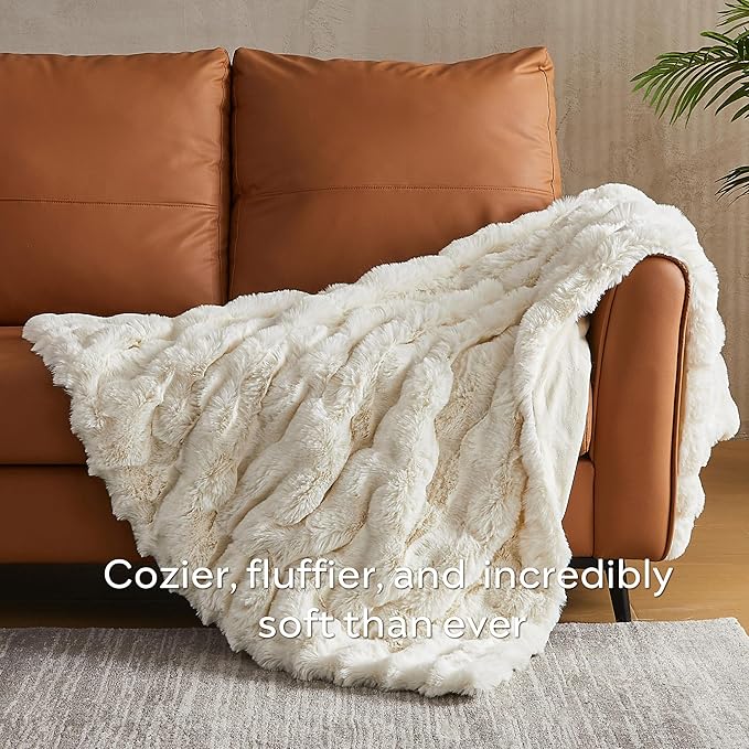 White plush faux fur throw blanket from CozyNest Decor, cozy and thick for queen-sized beds with fuzzy, soft texture.