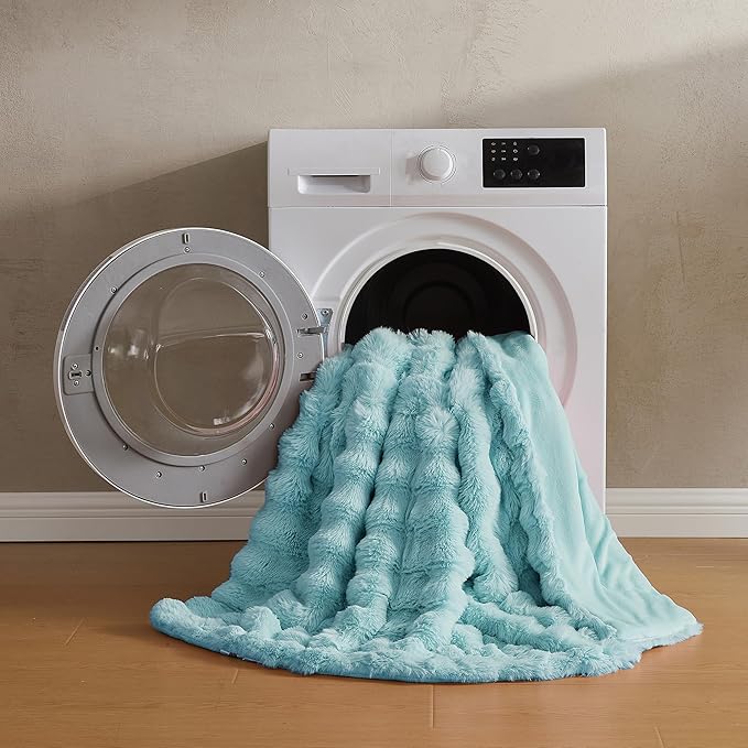 Blue plush faux fur throw blanket by CozyNest Decor, thick and warm twin-sized bed blanket with a cozy bubble texture.