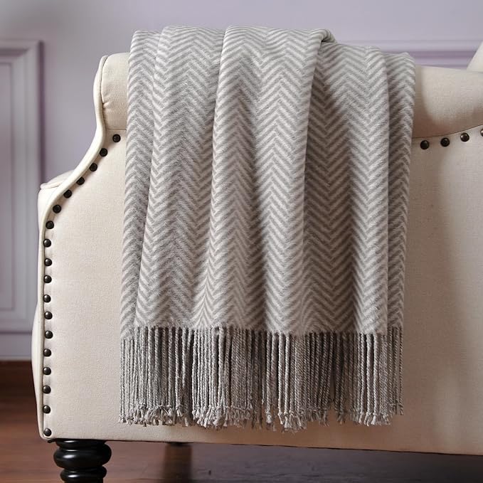 CozyNest Decor Cuddle Dreams silk throw blanket with hand-knotted fringe in gray herringbone, soft, breathable, and luxurious.