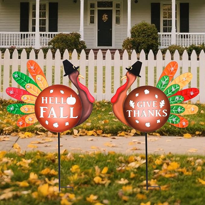 Two CozyNest Decor metal Thanksgiving yard stakes with LED lights featuring turkeys and fall harvest designs for garden or lawn decor.