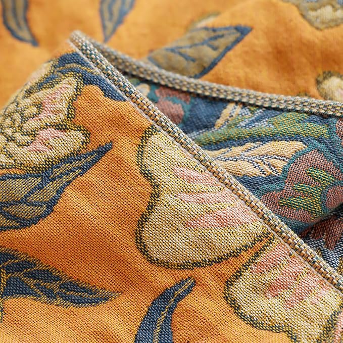 CozyNest Decor boho muslin cotton blanket with floral orange pattern, 80x90 inches, soft and lightweight for sofa or bed.
