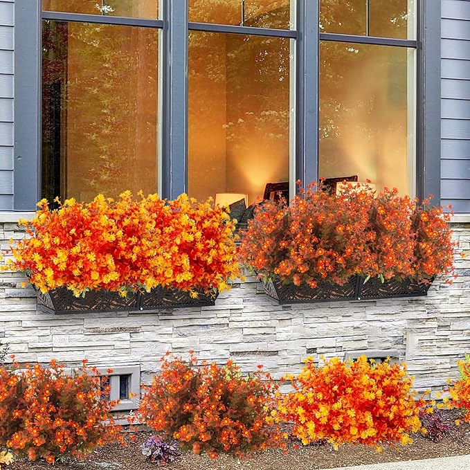 Artificial fall flowers in orange from CozyNest Decor, realistic faux autumn plants for indoor and outdoor holiday decor.