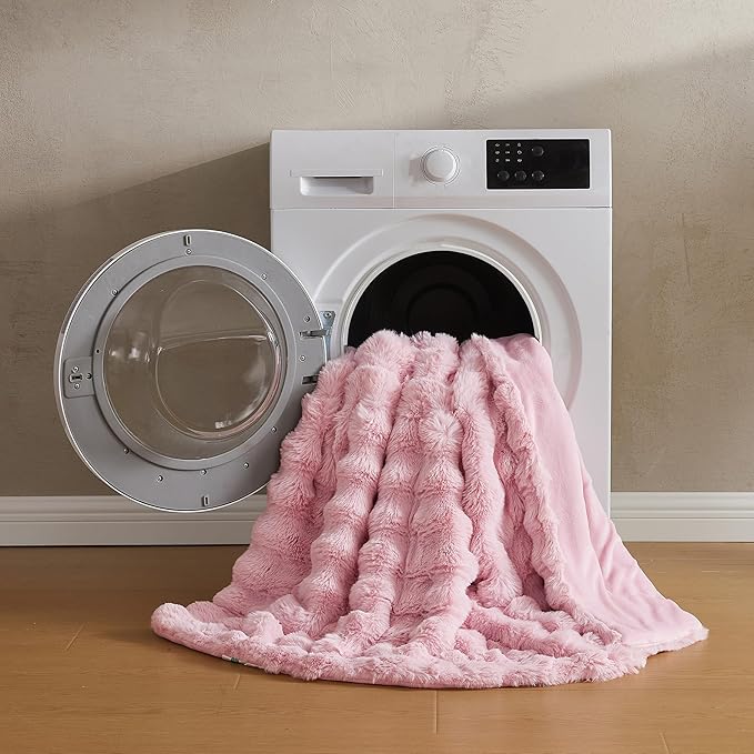 Pink faux fur throw blanket by CozyNest Decor, plush and cozy king size bed blanket with thick, warm, fuzzy bubble texture.