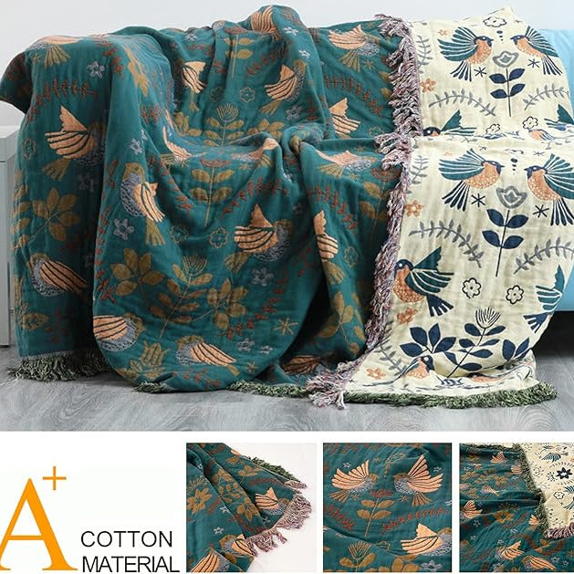 CozyNest Decor fall throw blanket with bird and flower patterns, versatile organic cotton blanket for beds, couches, and vintage decor.