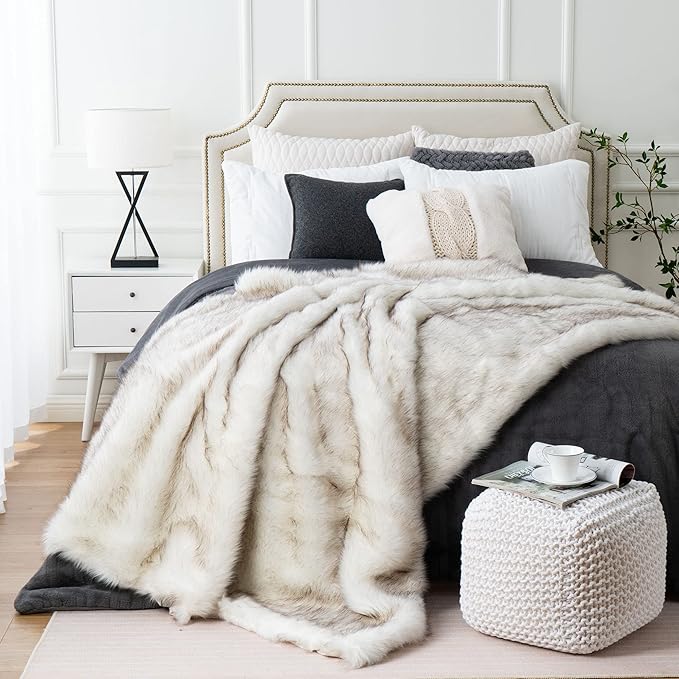 Luxurious ivory white faux fur throw blanket by CozyNest Decor, fluffy, soft, and cozy for bed or couch, reversible to plush velvet.