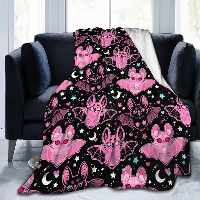 Pink CozyNest Decor fleece throw blanket for kids and adults, soft and cozy for couch, bed, or sofa decor.
