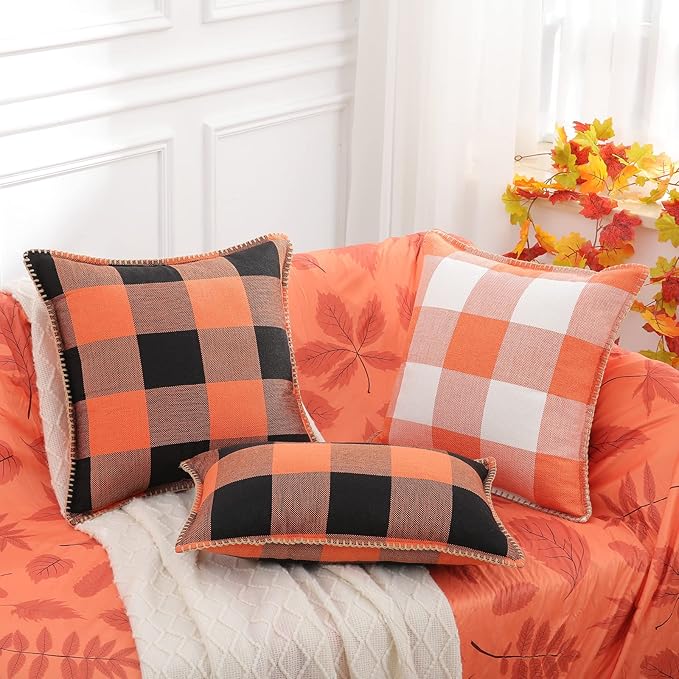 CozyNest Decor fall orange and black buffalo plaid throw pillow covers, 18x18 inches, with stitched edges for autumn home decor.