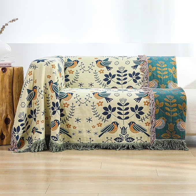 CozyNest Decor boho throw blanket with bird and flower patterns, soft organic cotton for beds, couches, and vintage decor.