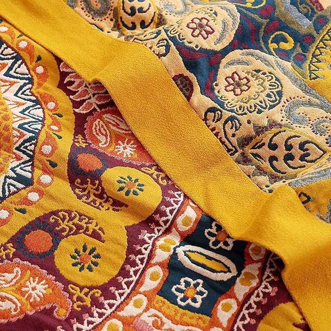 Boho orange muslin bed blanket by CozyNest Decor, 80x90 inches, soft 4-layer gauze cotton with geometric floral design for sofa or bed.