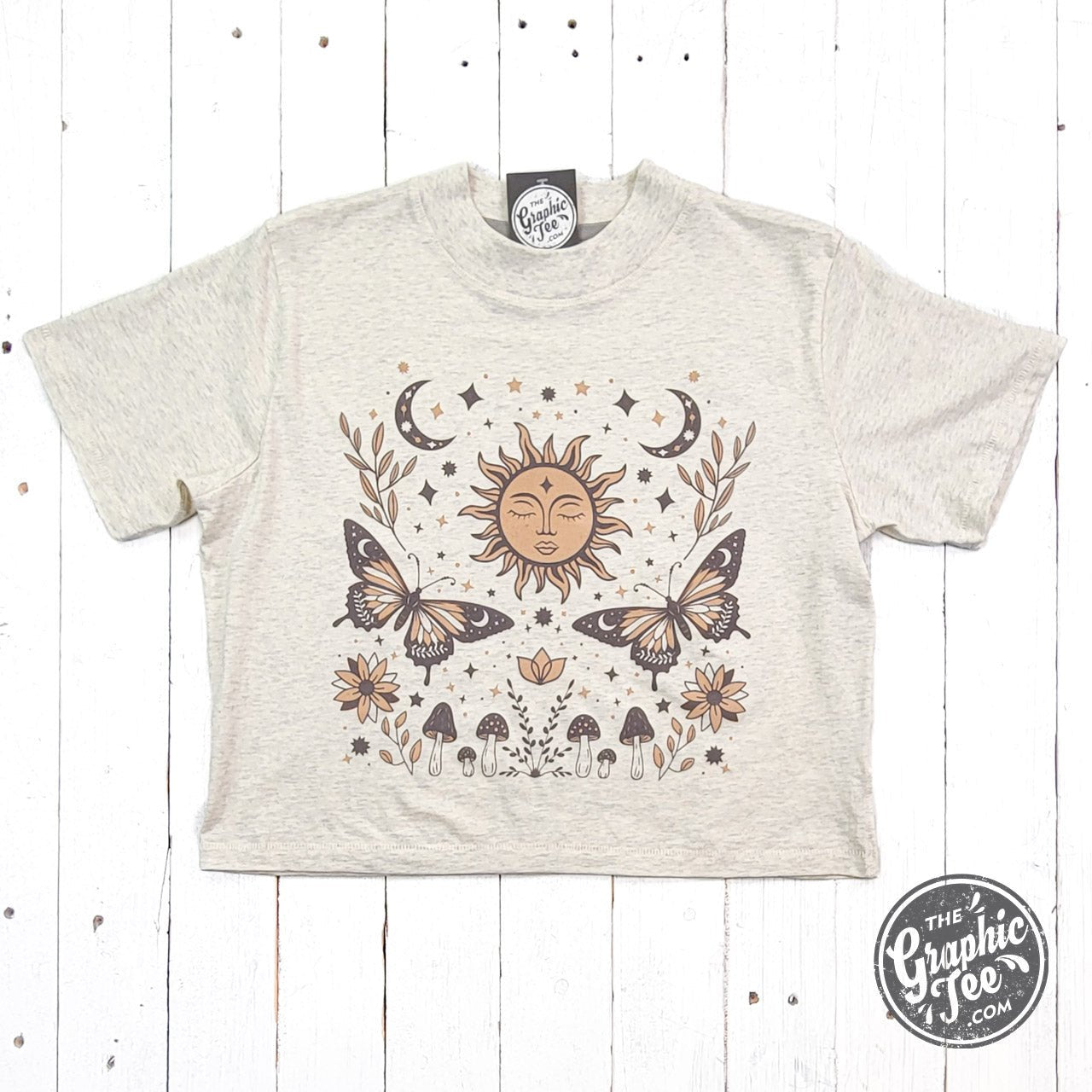 The Graphic Tee 90's Vibes celestial mid-length crop short sleeve shirt with drop sleeves and retro design.