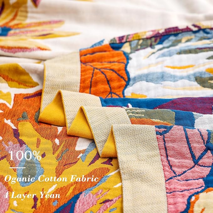 CozyNest Decor boho large throw blanket with fall floral and bird design, made of 100% organic cotton, perfect for sofa or bed.