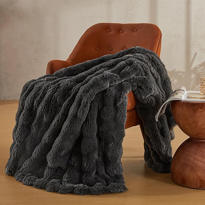 Dark grey JELLYMONI Faux Fur Throw Blanket by CozyNest Decor, plush and cozy bed blanket, 50x60 inches, thick and warm.