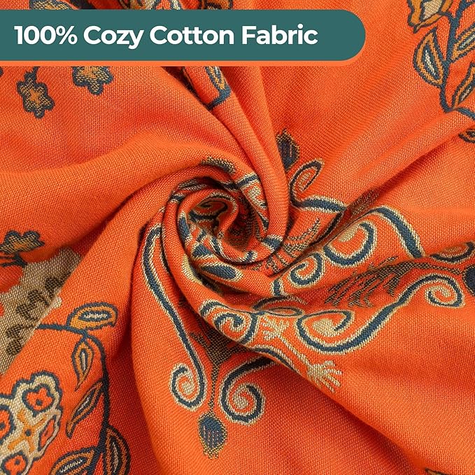 CozyNest Decor fall floral printed cotton throw blanket on a bed, lightweight rustic quilt in orange with a floral pattern.
