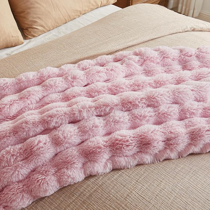 Pink fuzzy faux fur throw blanket by CozyNest Decor, plush and cozy king-size bed blanket with thick, warm bubble texture.