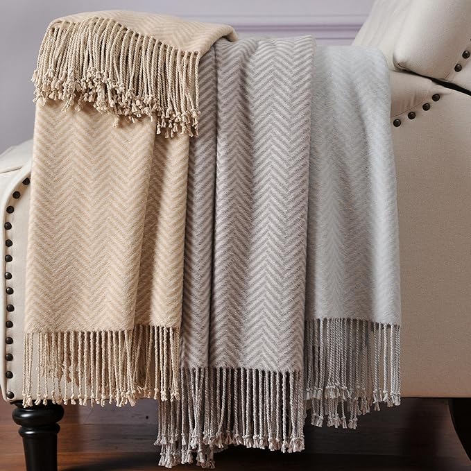 CozyNest Decor Cuddle Dreams silk throw blanket with hand-knotted fringe in taupe, soft, breathable herringbone pattern.