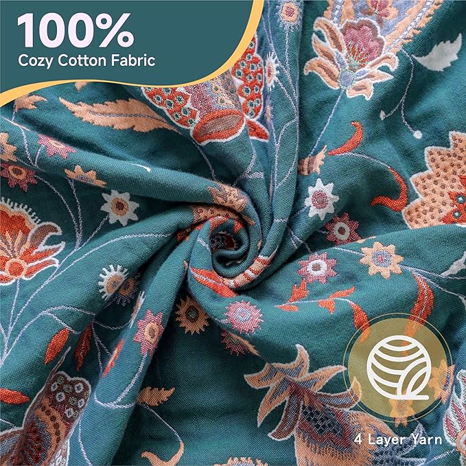 CozyNest Decor boho large cotton throw blanket with tassels, lightweight rustic quilt draped over a sofa for home decor.