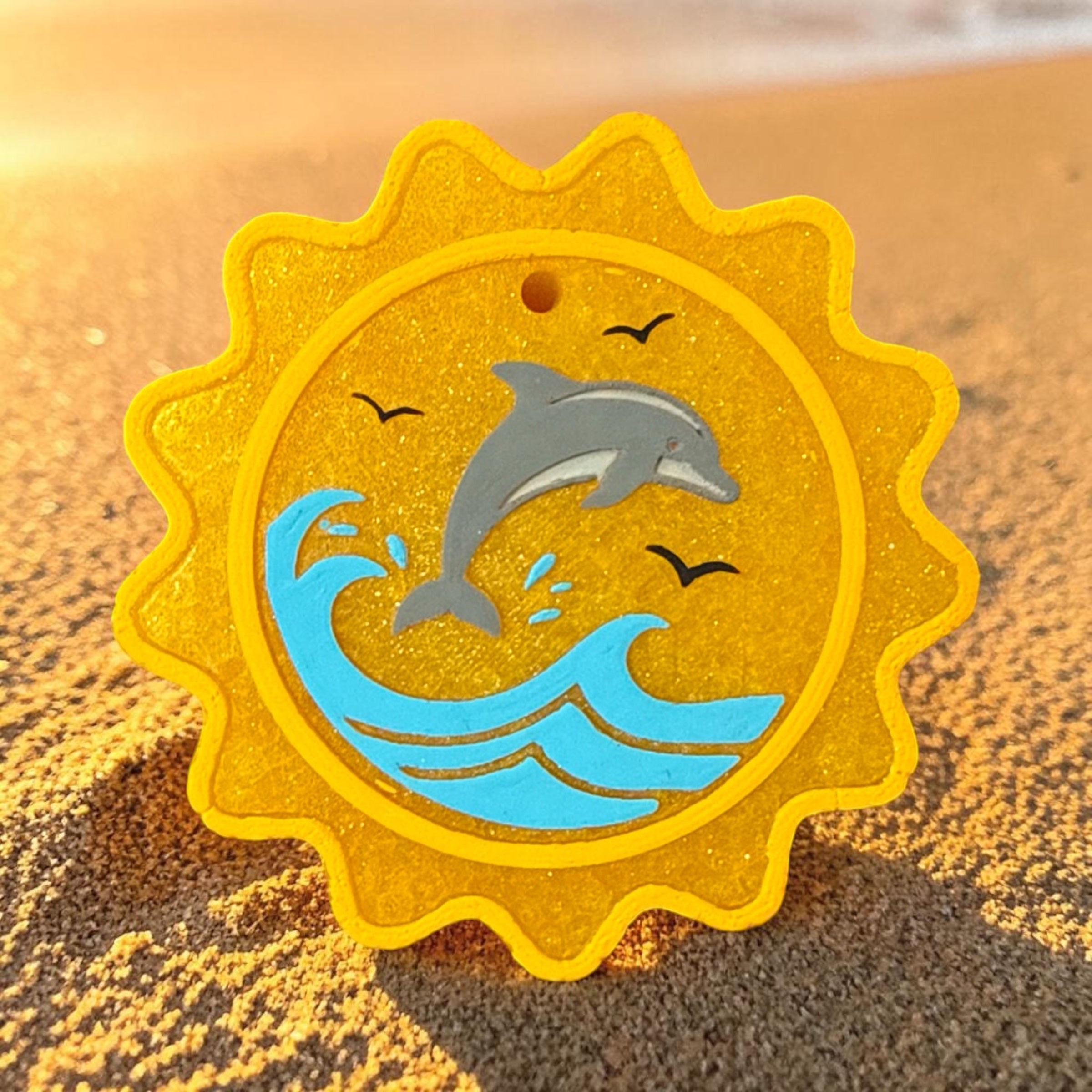 Jumping Sunsets Freshie from Bug & Bean Freshies features a colorful, vibrant air freshener with a playful sun-themed design.