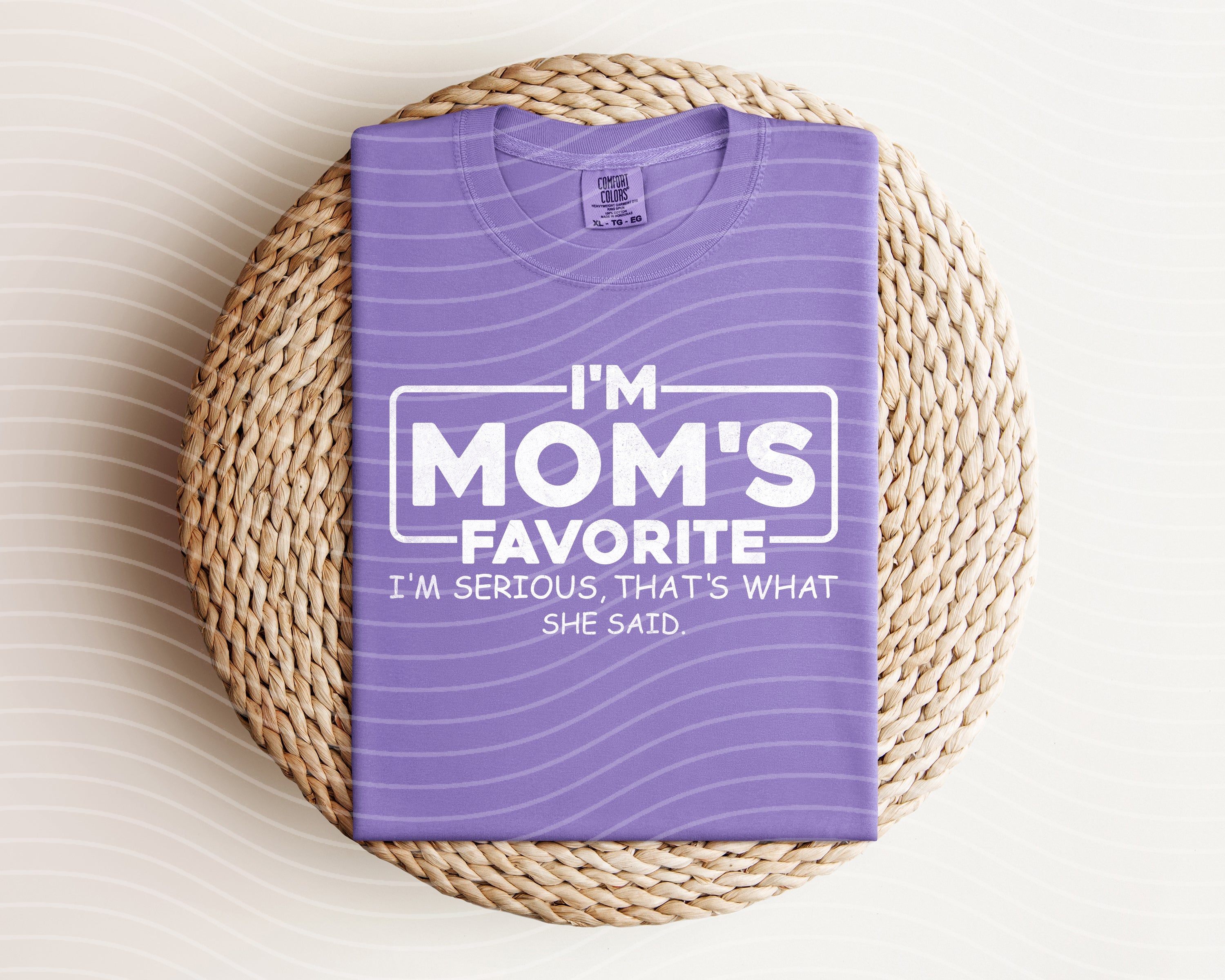 I'm Mom's Favorite graphic tee by Anchored Grace Boutique featuring a casual, stylish design with bold text on soft fabric.