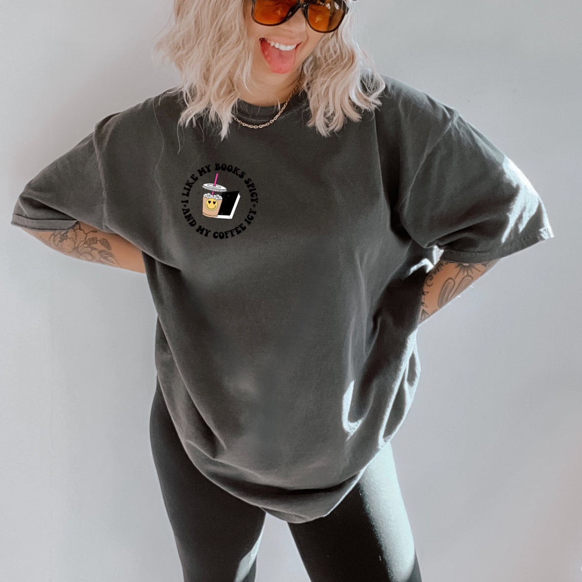 Spicy Books graphic T-shirt from Shop Karma Tees featuring colorful book illustrations and bold text design.