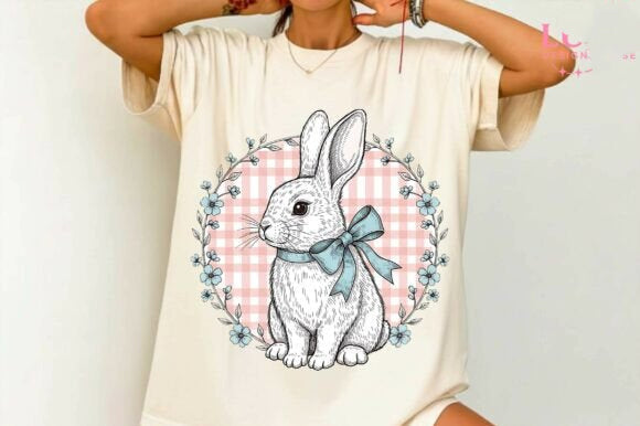 Dainty Bunny Graphic Tee by Anchored Grace Boutique featuring a cute bunny illustration on a soft cotton t-shirt.