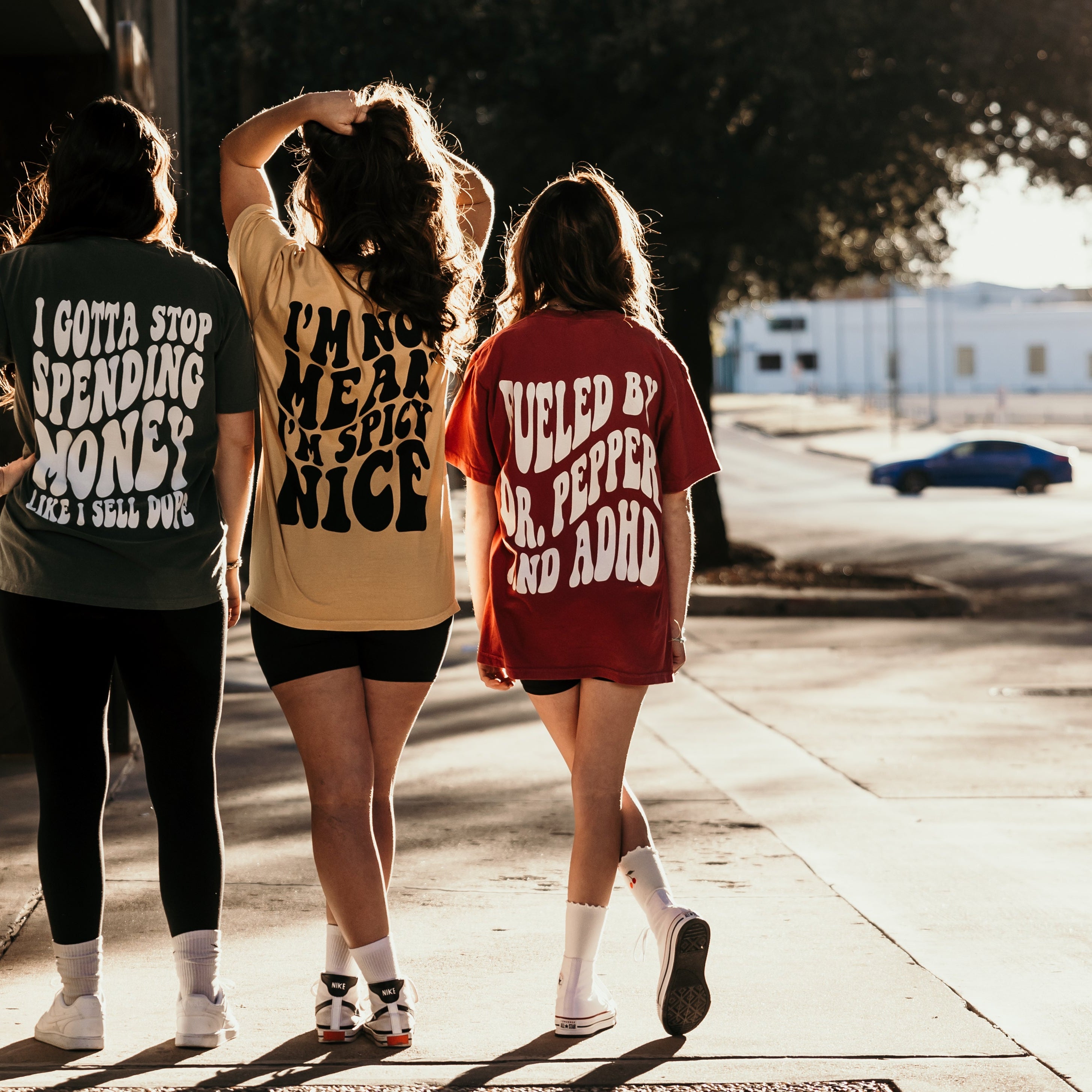 Black graphic t-shirt with "I'm Spicy Nice" design from Shop Karma Tees, casual style with bold text on front.