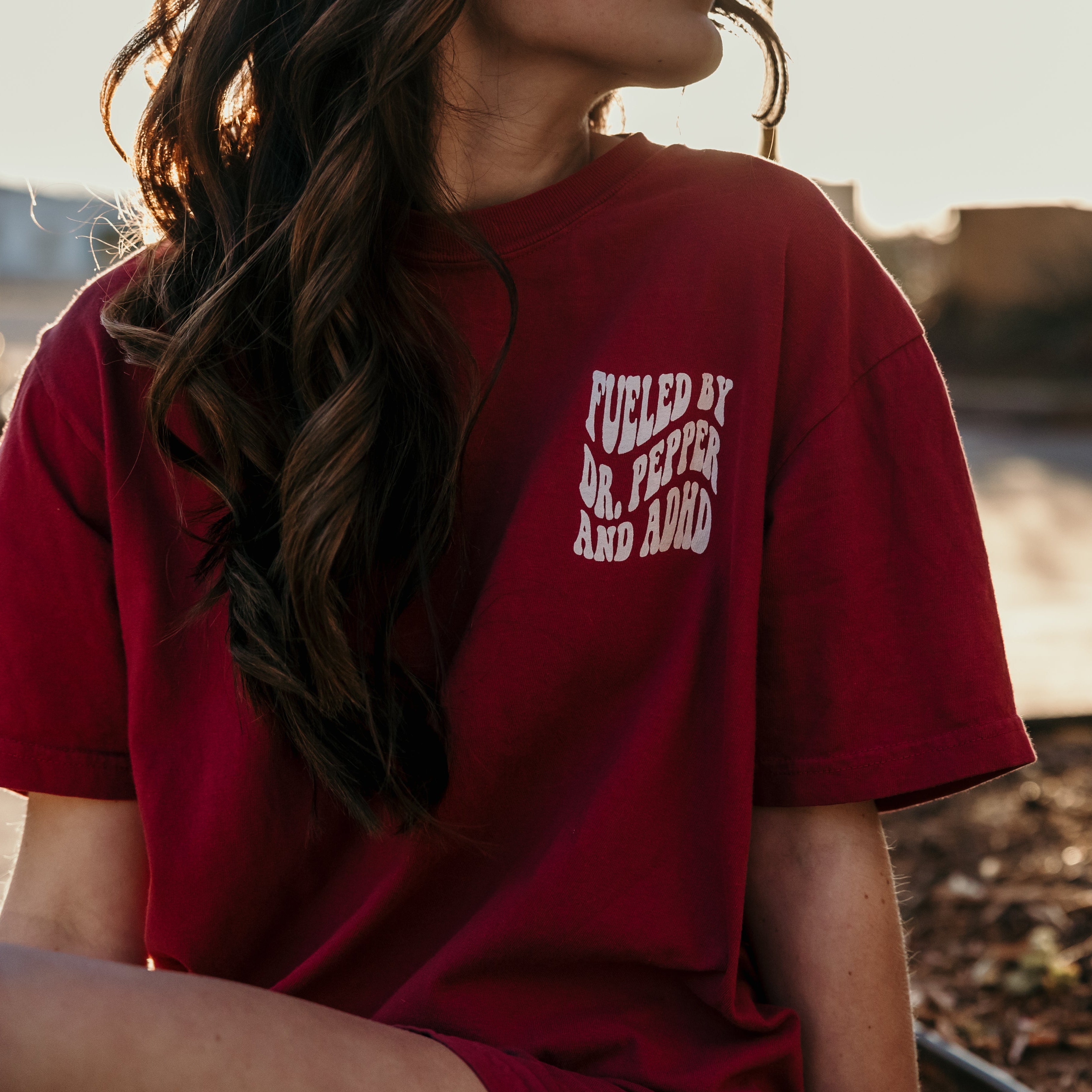 Graphic T-shirt featuring Dr. Pepper and ADHD designs from Shop Karma Tees, showcasing a casual, printed cotton tee with vibrant artwork.