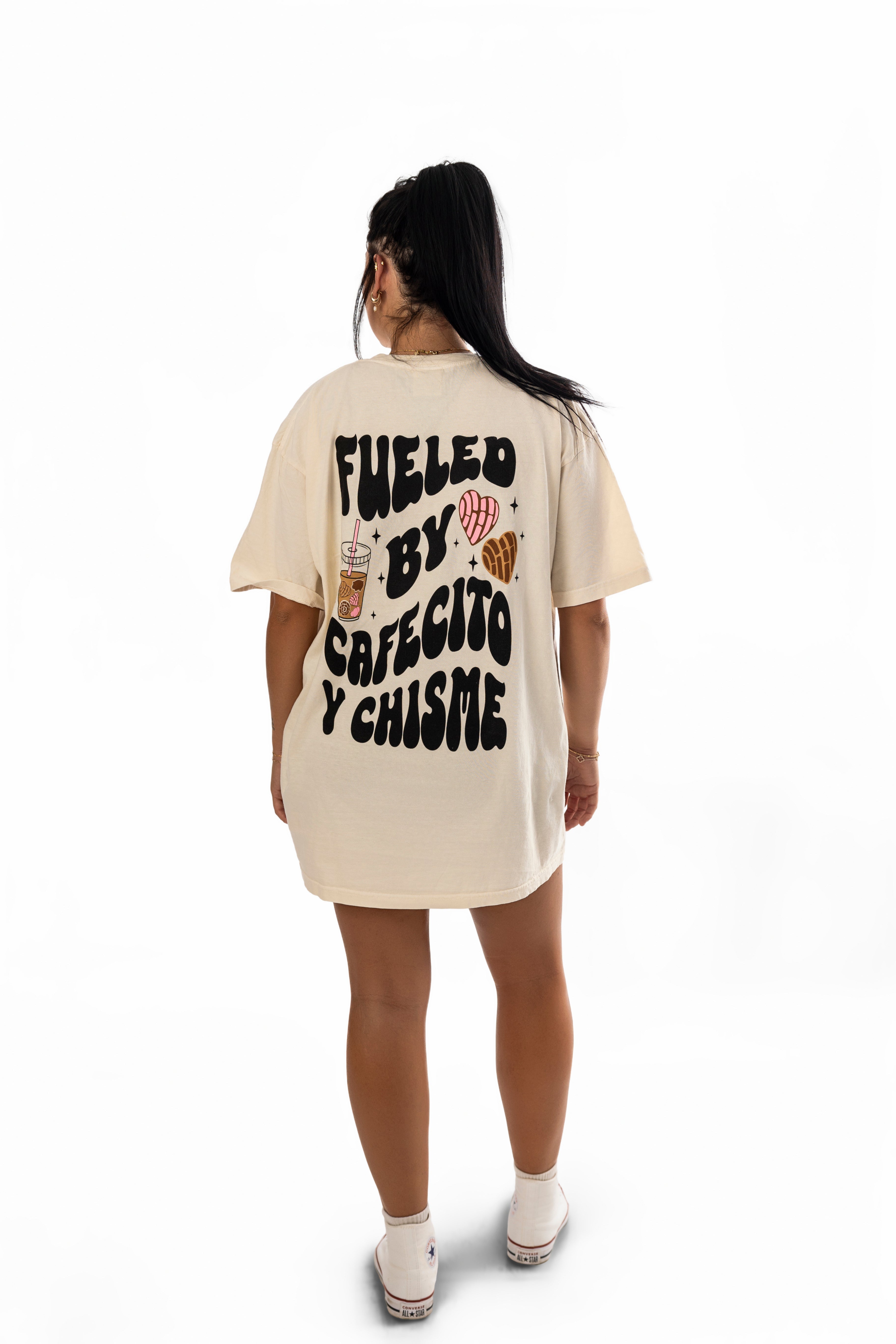 Black t-shirt featuring "Fueled by Cafecito Y Chisme" printed design from Shop Karma Tees.