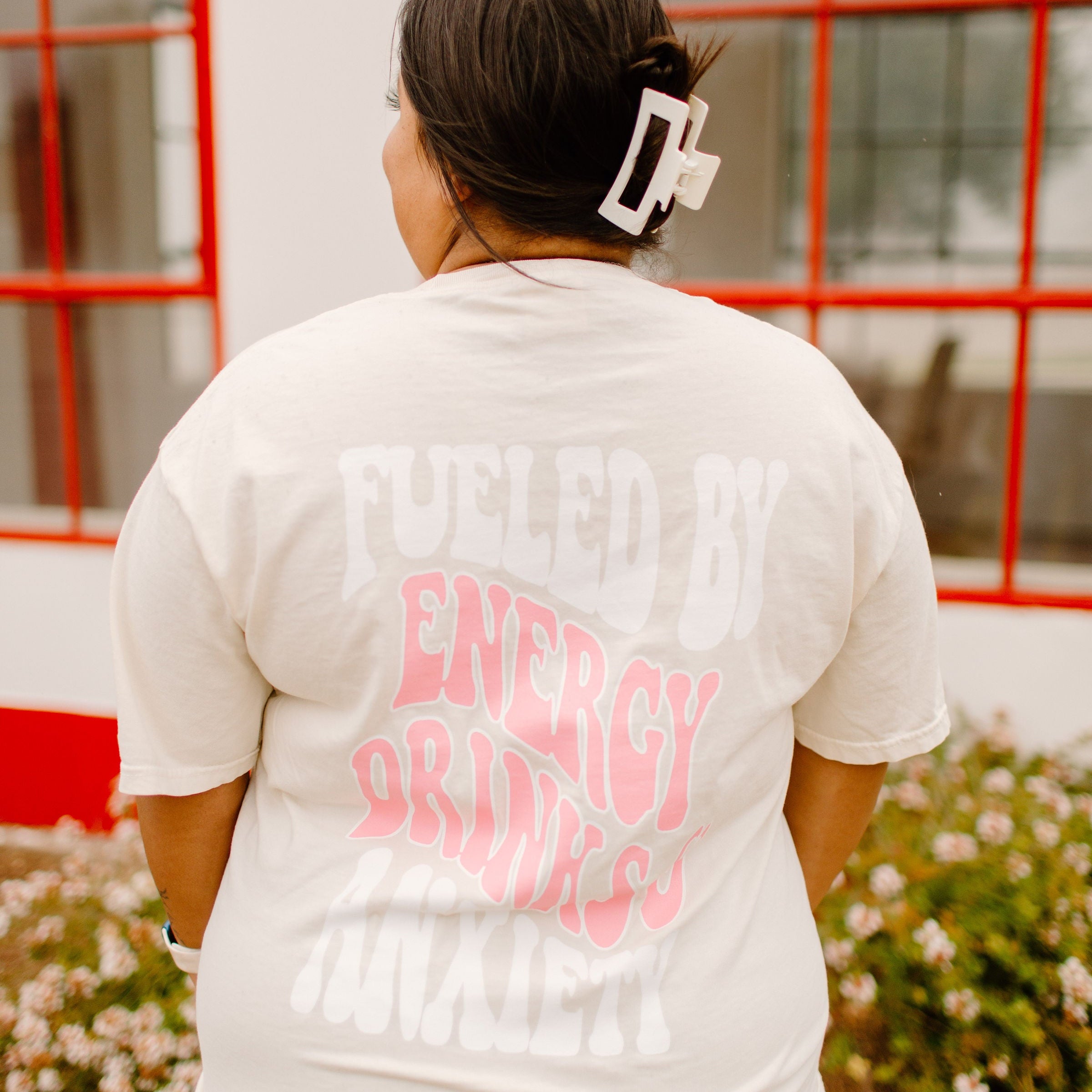 Graphic tee featuring "Fueled By Energy Drinks and Anxiety" design by Shop Karma Tees, with vibrant print on a casual cotton t-shirt.