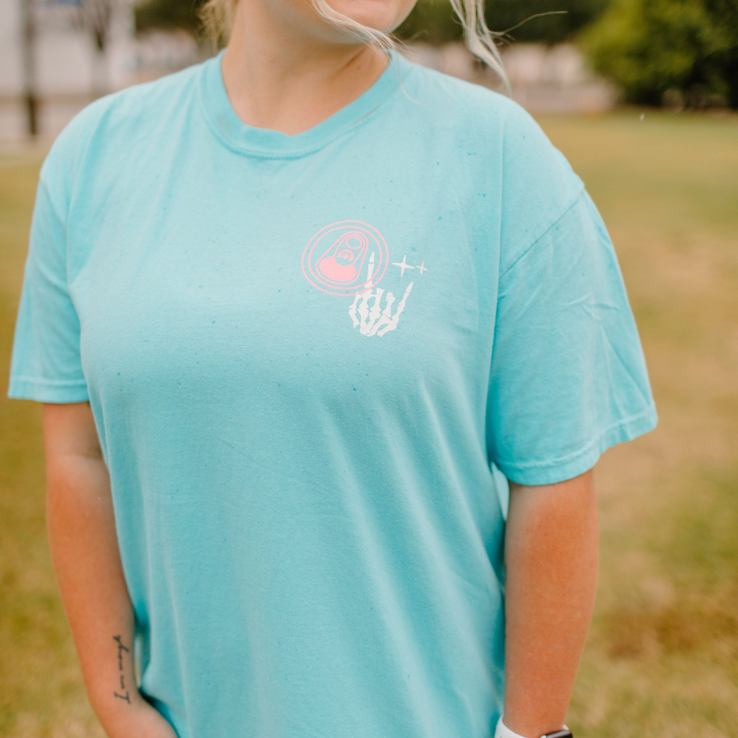 Graphic tee featuring "Fueled By Energy Drinks and Anxiety" design by Shop Karma Tees, with bold text and casual fit.