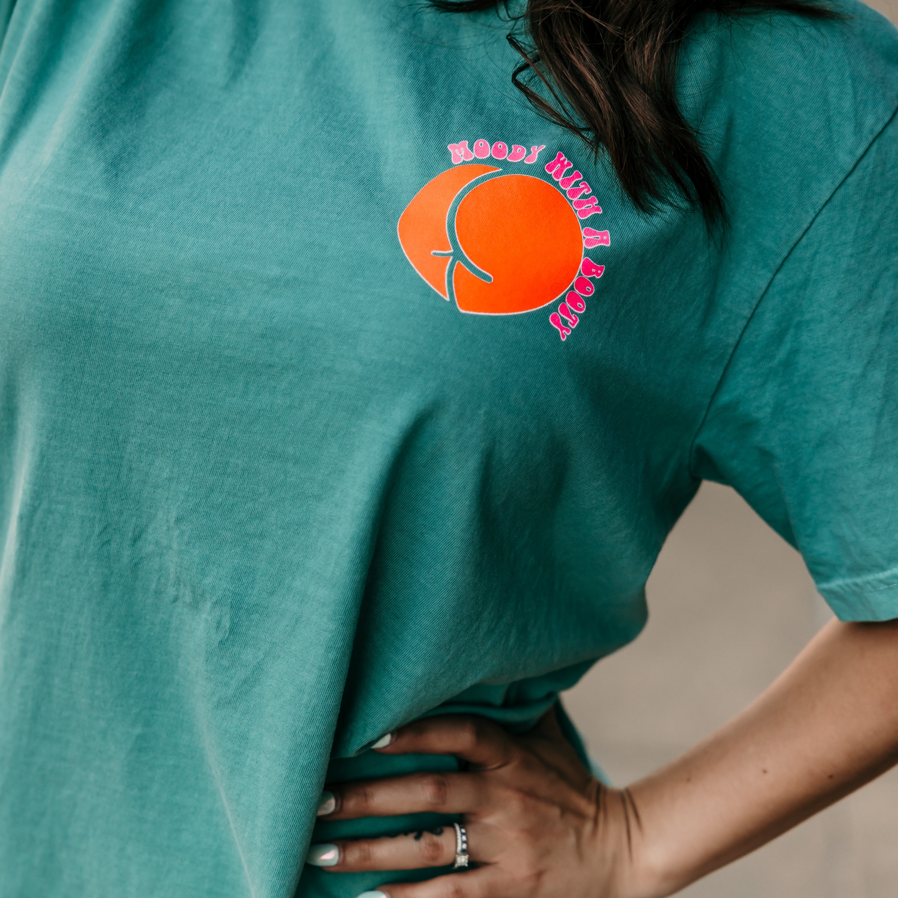 Moody with a booty graphic T-shirt from Shop Karma Tees featuring a bold, colorful design on soft cotton fabric.