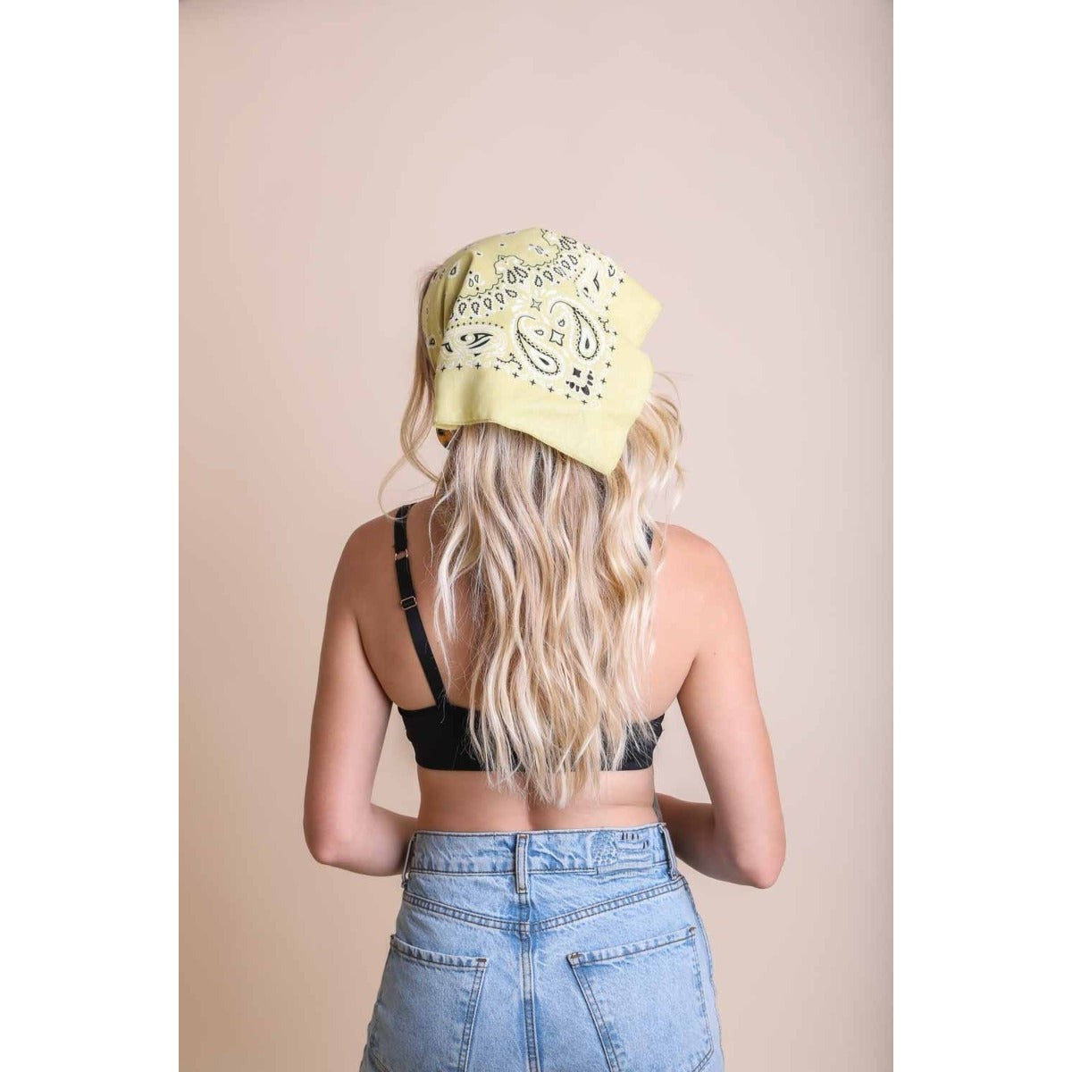 Muted yellow lemon boho bandana and hair scarf headwrap, stylish accessory for boho-inspired hair and head styling.