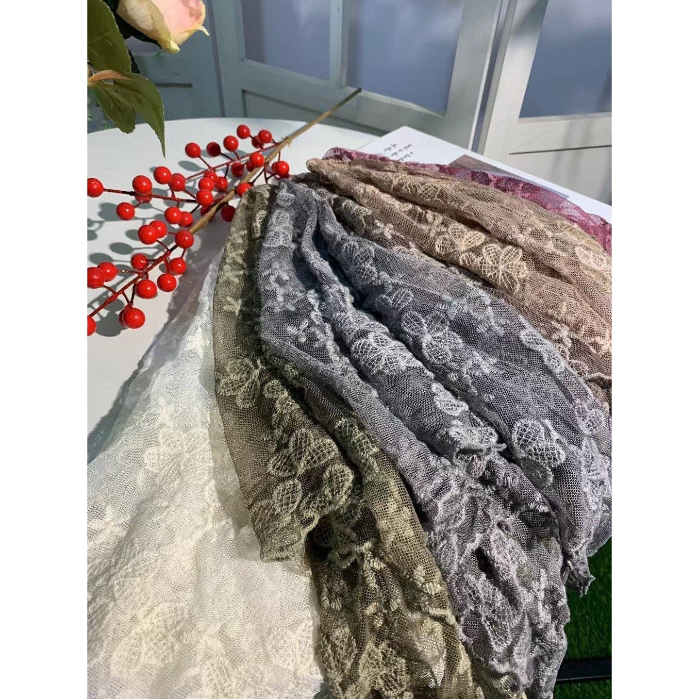 Embroidered floral lace shawl or shrug from The Bullish Store featuring delicate blossom patterns, perfect as a romantic accessory.