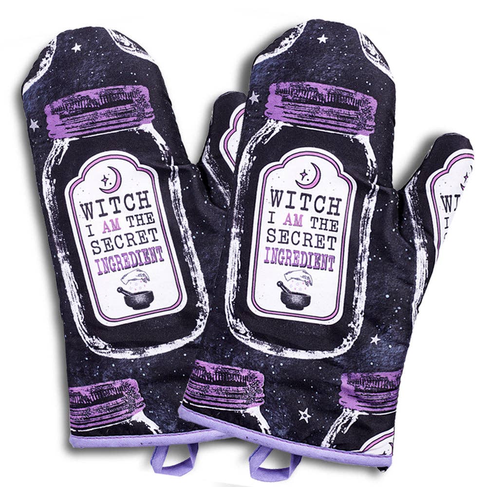 Set of 2 Halloween-themed oven mitts and pot holders with witch design from The Bullish Store, hanging and ready for use.