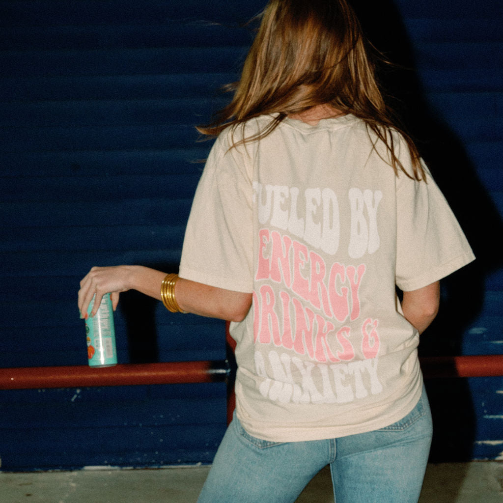 Graphic tee featuring "Fueled By Energy Drinks and Anxiety" text, casual fit, black cotton fabric, from Shop Karma Tees.