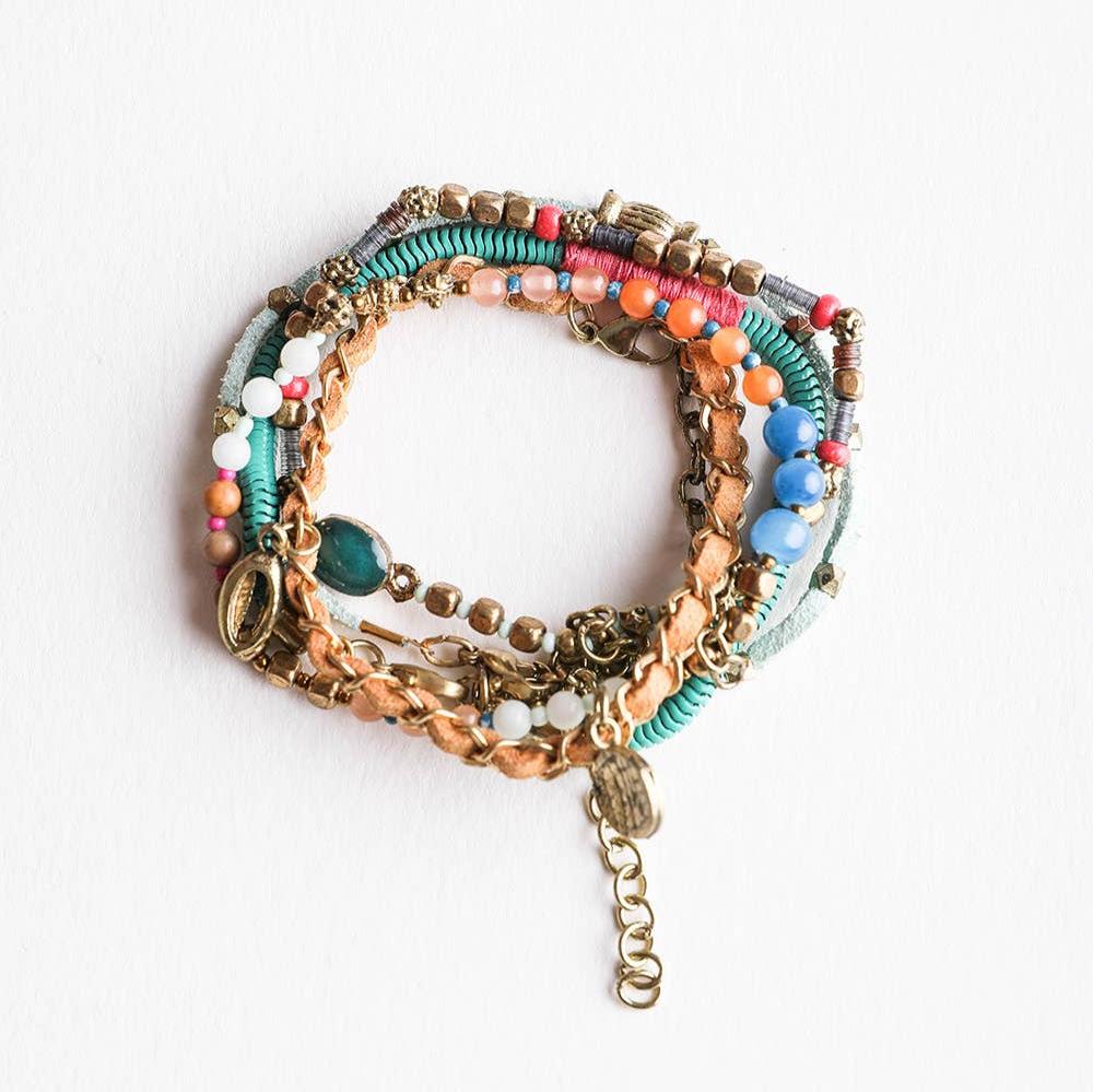 Stack of five teal and multi-suede boho bracelets with layered design, layered jewelry style, from The Bullish Store.