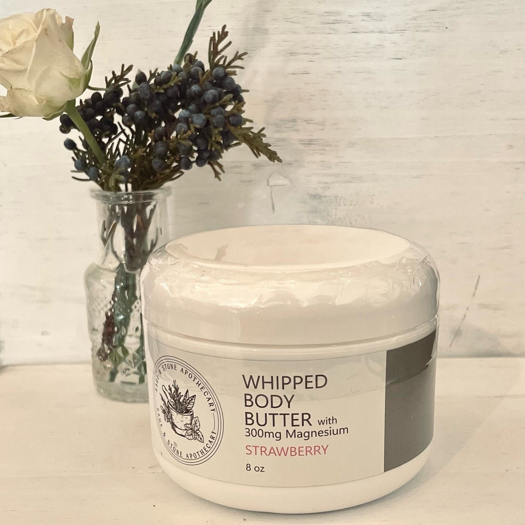 Whipped strawberry magnesium body butter from Sage & Stone Apothecary, creamy and luxurious for nourishing skin and wellness.