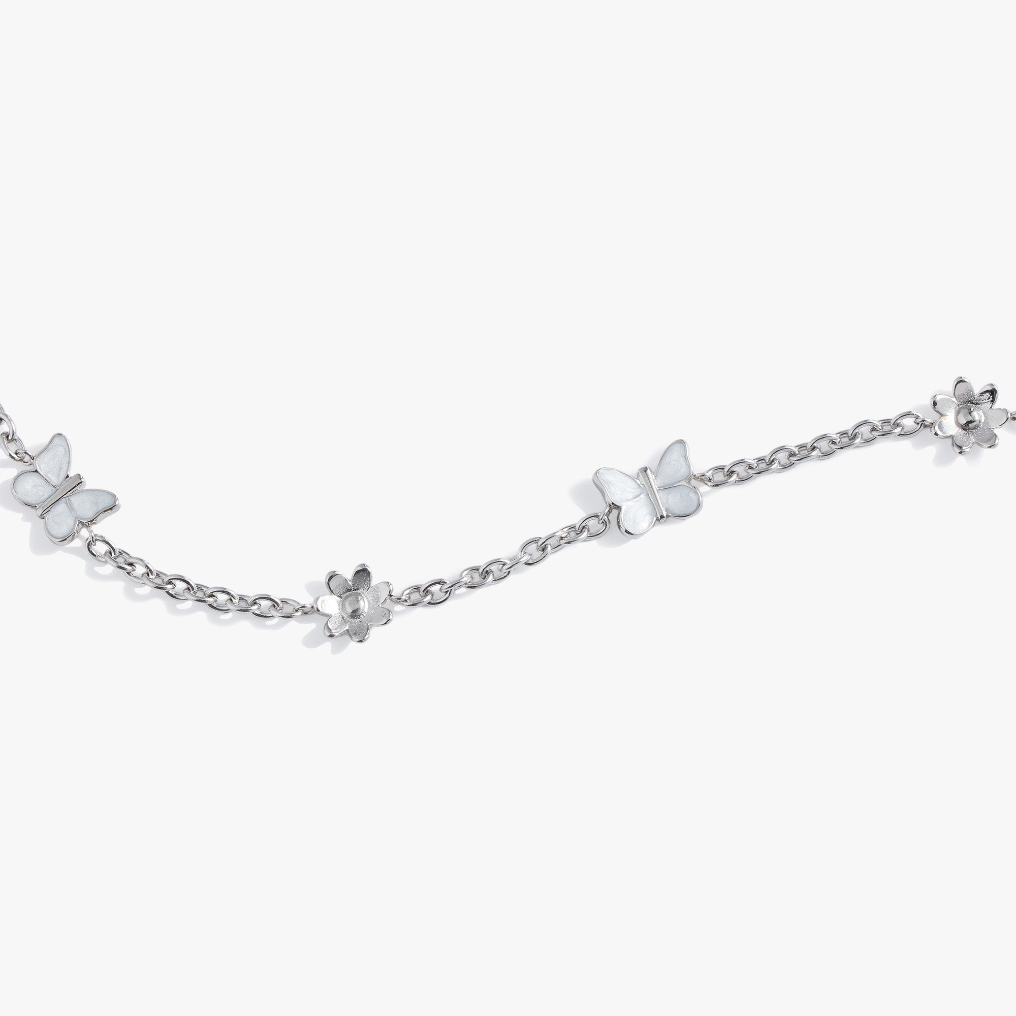 Gold stainless steel butterfly and flower anklet by ALEX AND ANI featuring delicate charms and adjustable chain.