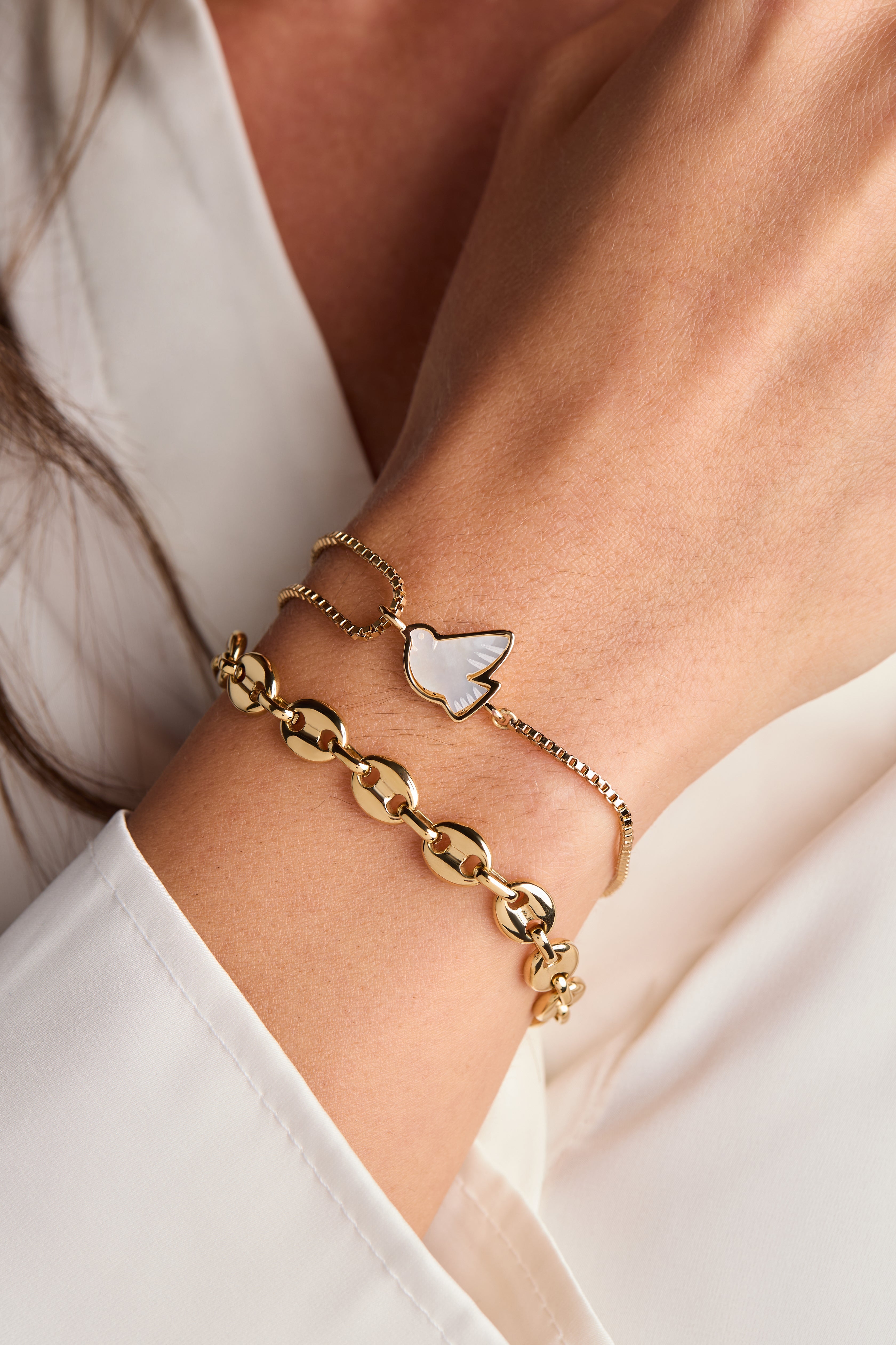 Gold ALEX AND ANI Dove 'Peace' Mother of Pearl pull chain bracelet with elegant design and mother of pearl accents.