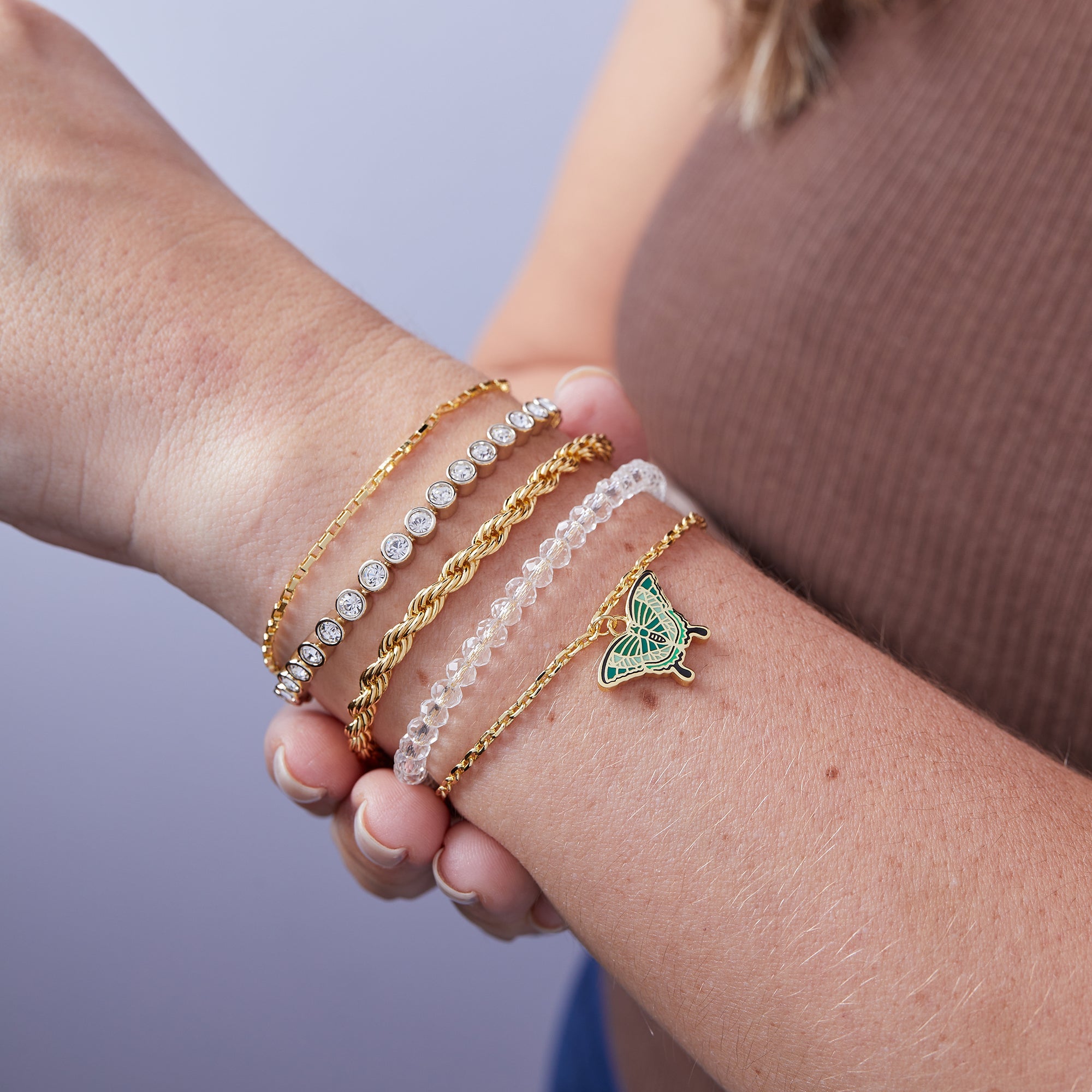 Gold Emerald Swallowtail Butterfly Charm Bracelet by ALEX AND ANI featuring a detailed butterfly pendant on a delicate chain.