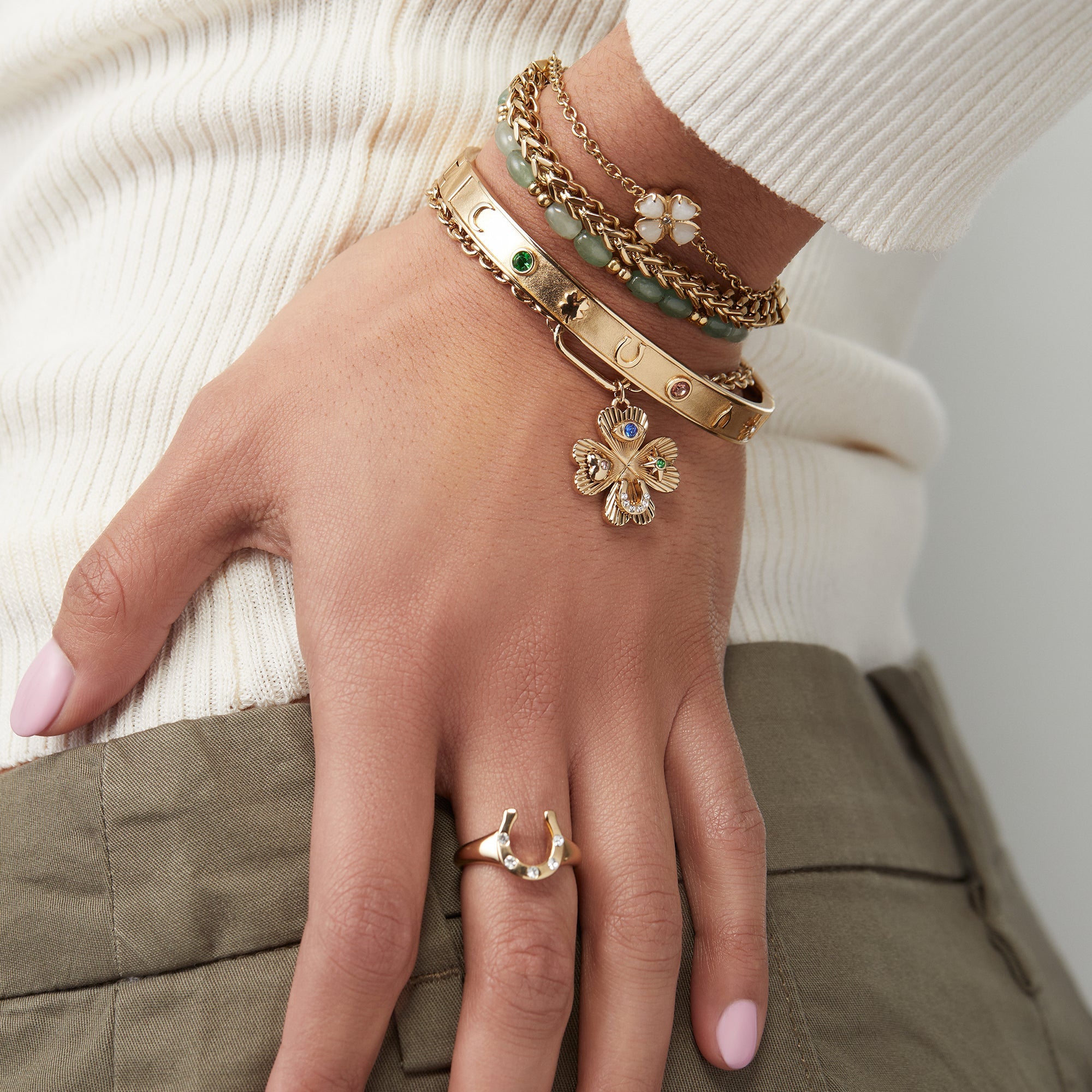 Gold ALEX AND ANI Lucky Four Leaf Clover adjustable bracelet with charm, stylish jewelry accessory.