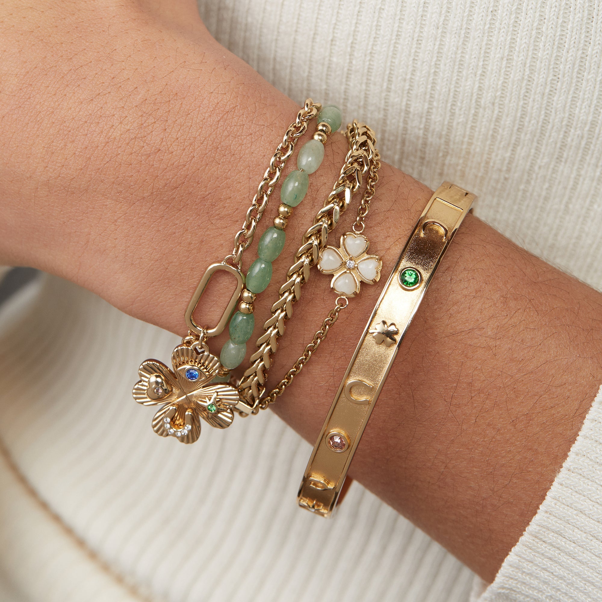 Gold ALEX AND ANI Lucky Hinge Bangle bracelet with a sleek, hinged design and engraved charm for elegant wristwear.