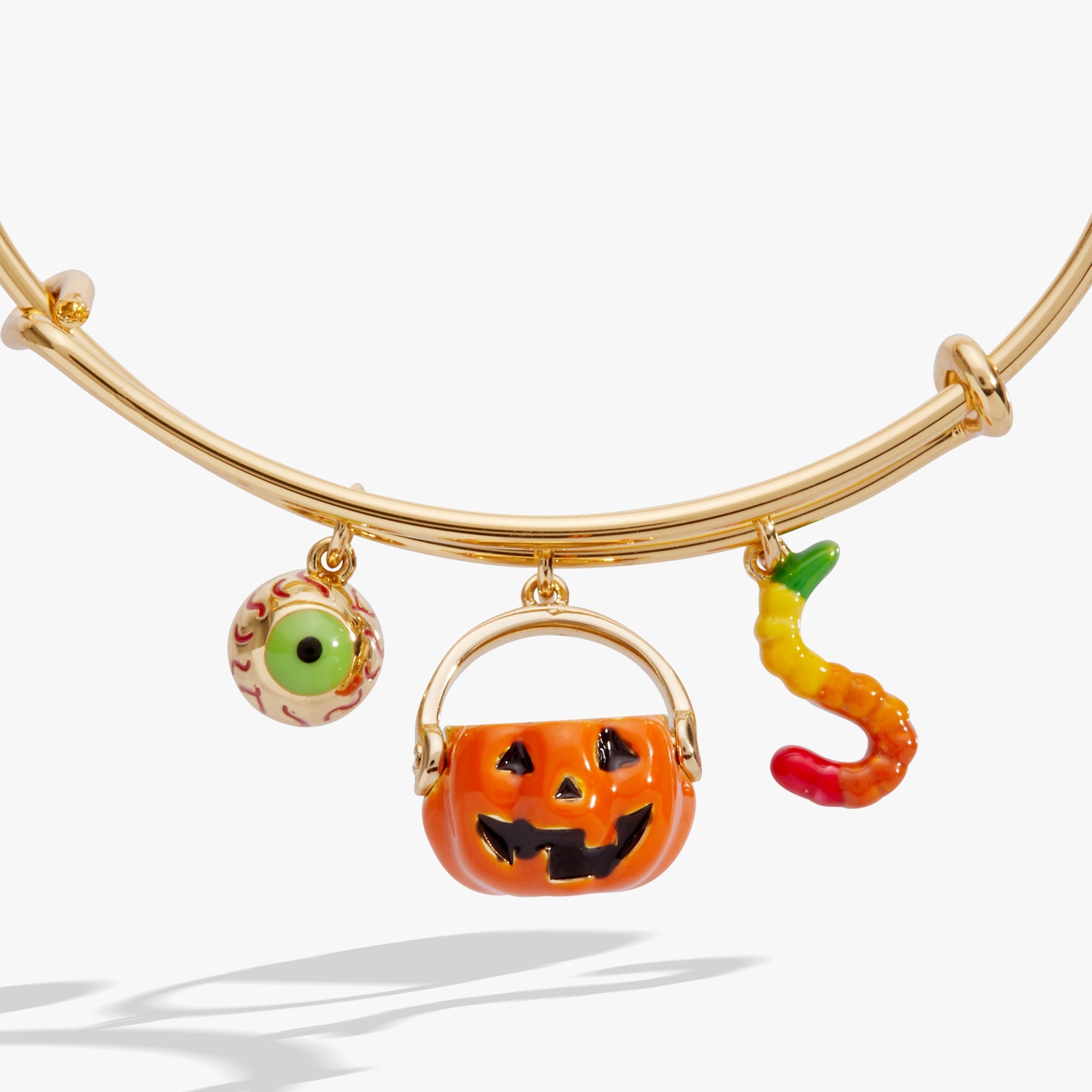 Gold 'Trick or Treat' Multi Charm Bangle by ALEX AND ANI featuring Halloween-themed charms on a stylish bracelet.