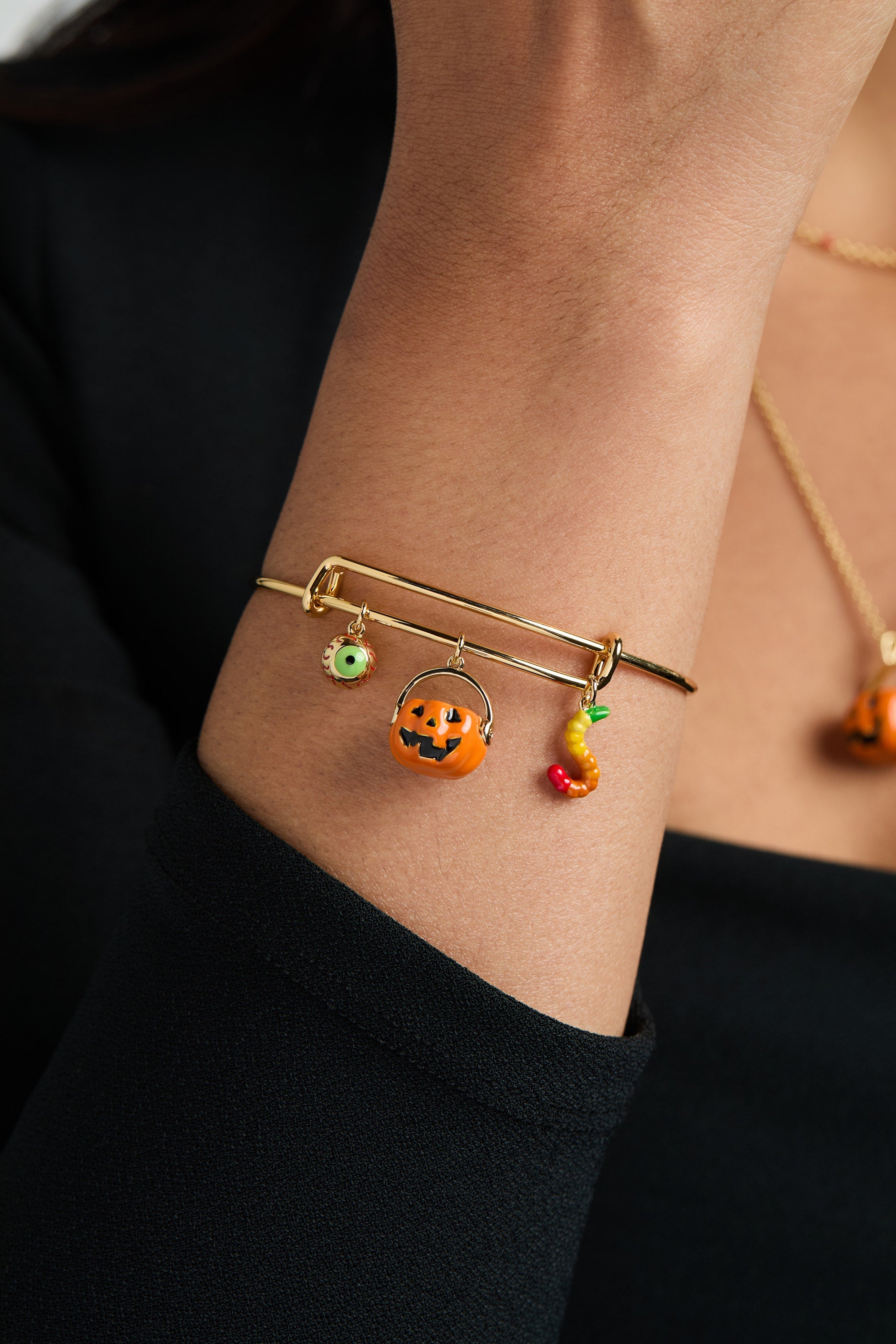 Gold 'Trick or Treat' multi charm bangle bracelet by ALEX AND ANI featuring festive Halloween-themed charms.