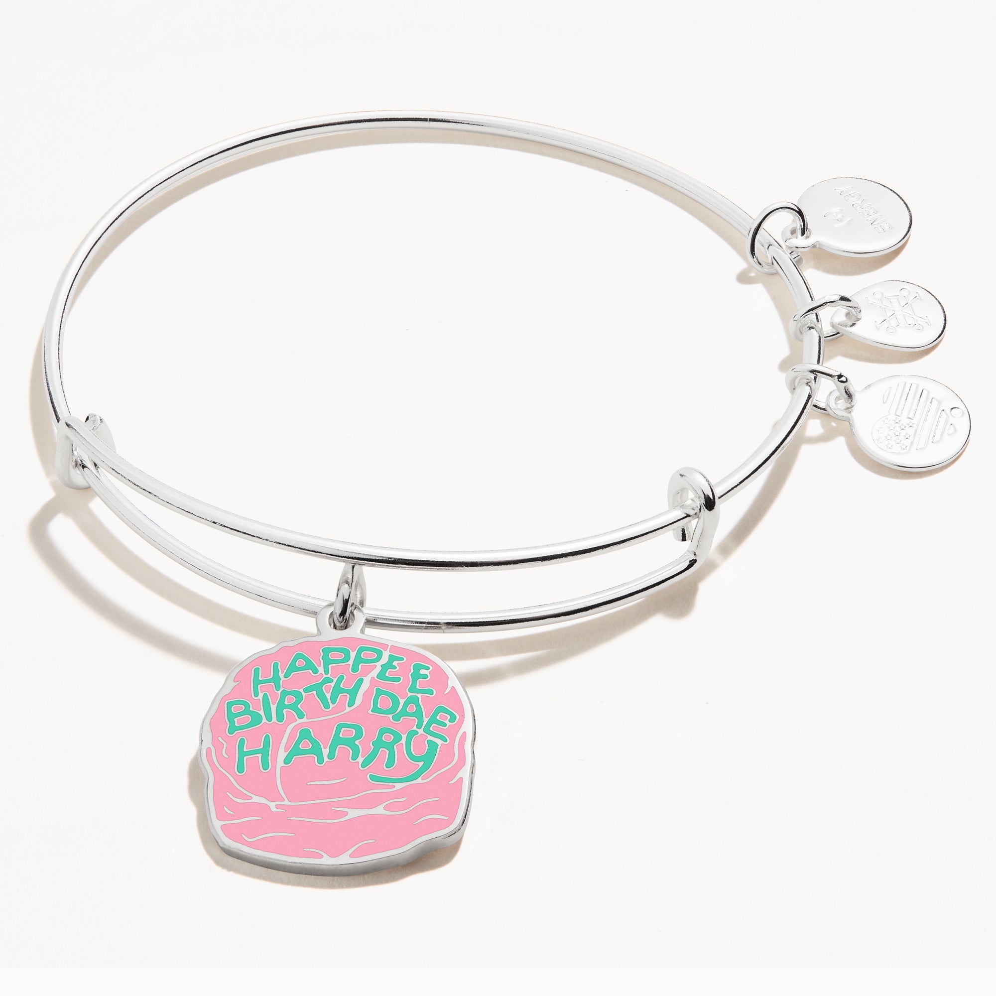 Silver Harry Potter Celebrate Cake charm bracelet by ALEX AND ANI featuring a detailed cake charm on a sleek bangle.