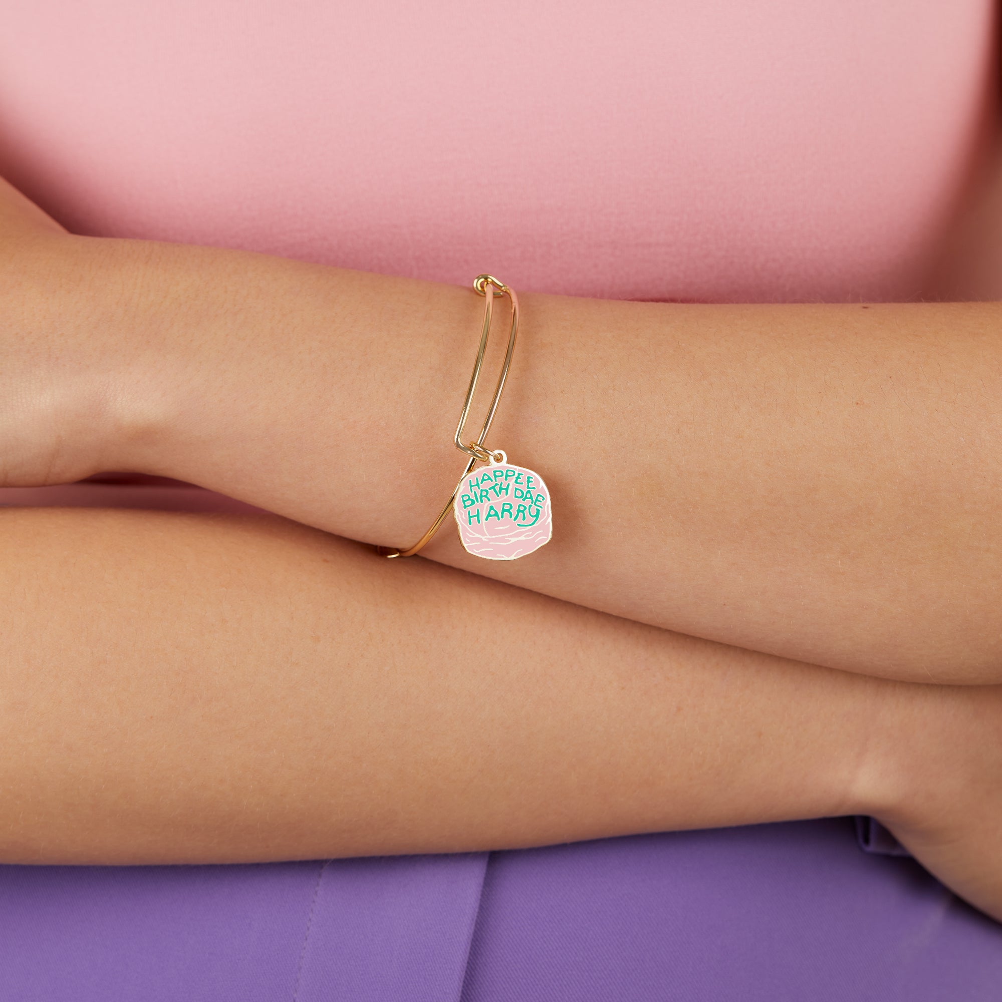 Silver Harry Potter Celebrate Cake Charm Bangle bracelet by ALEX AND ANI with detailed Harry Potter-themed charm design.