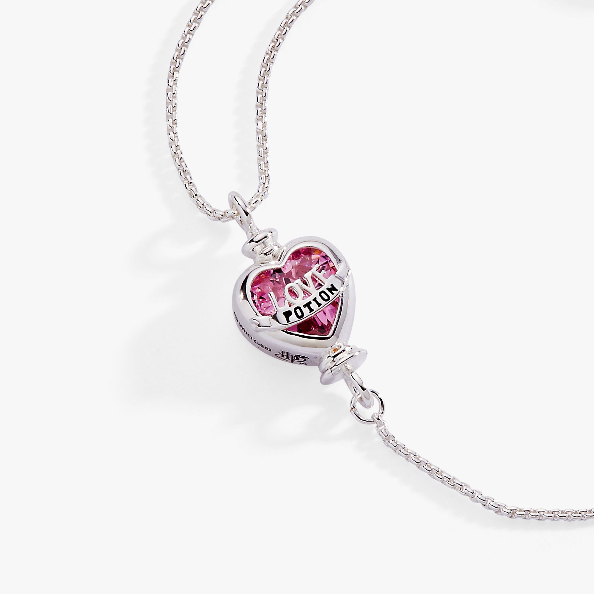 ALEX AND ANI Harry Potter Love Potion crystal pull chain bracelet with silver finish and mystical charm details.