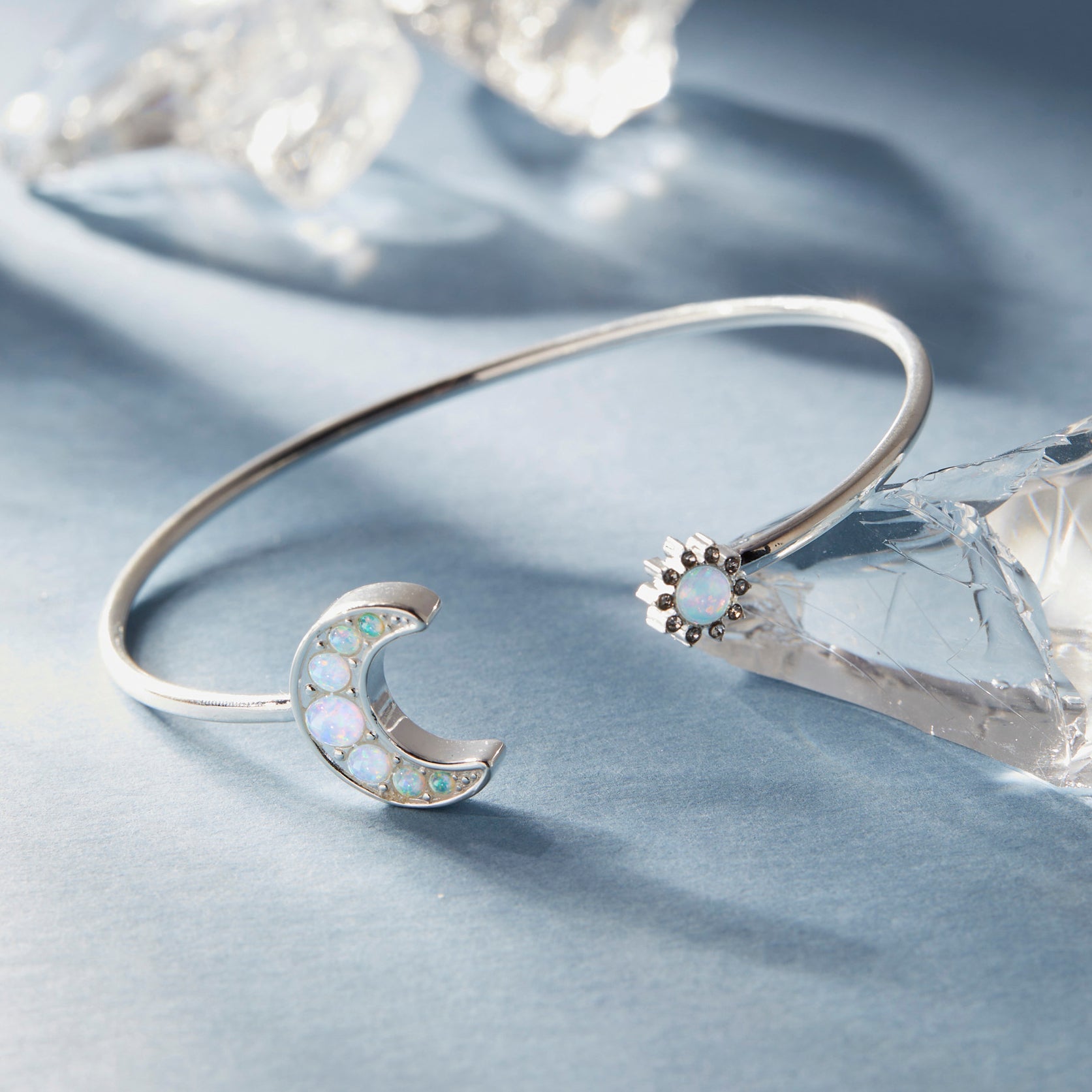 Silver Moon and Sun Flex Cuff bracelet by ALEX AND ANI featuring celestial designs and adjustable fit.