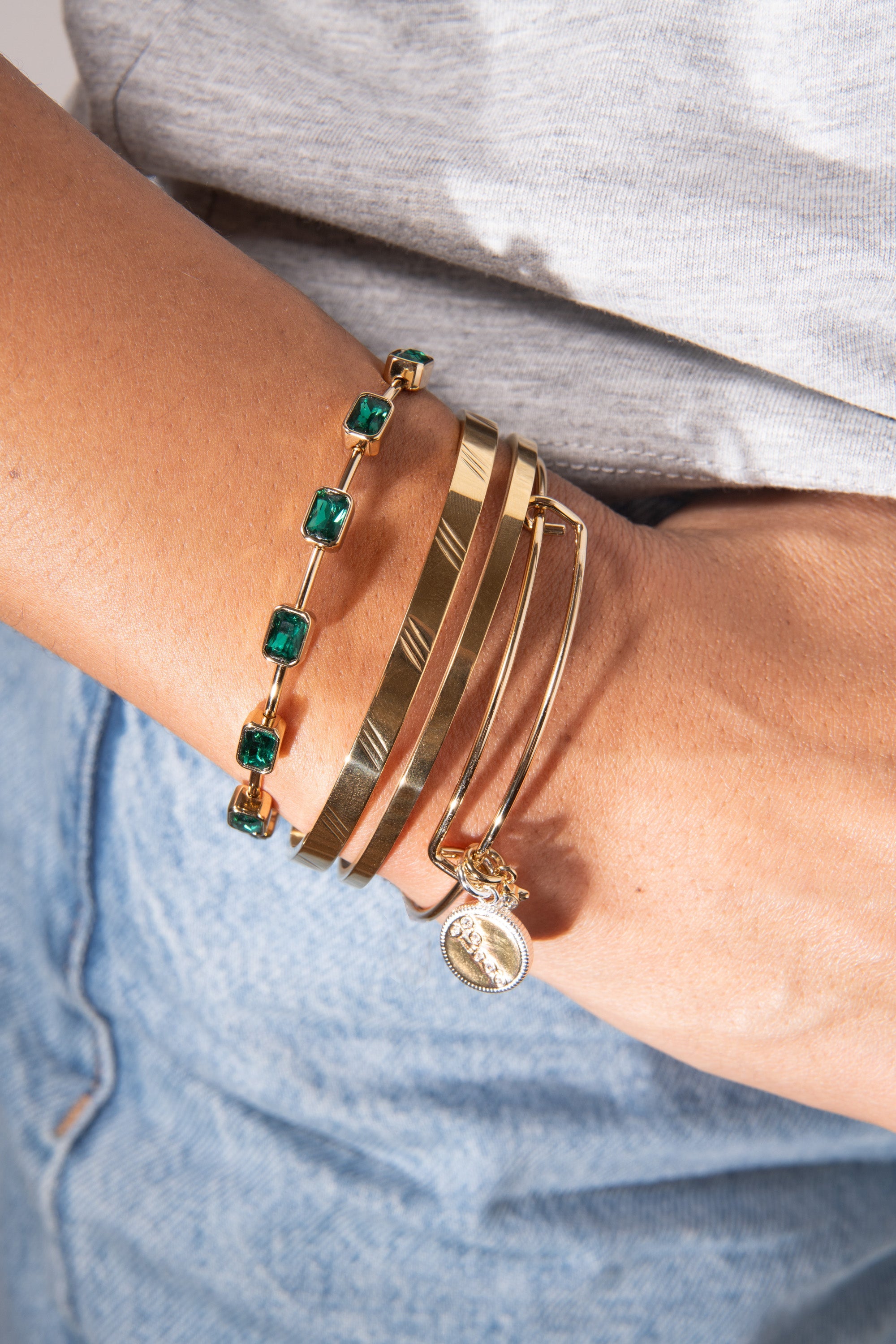Two-tone Taurus zodiac charm bangle bracelet by ALEX AND ANI featuring a detailed Taurus symbol and elegant design.